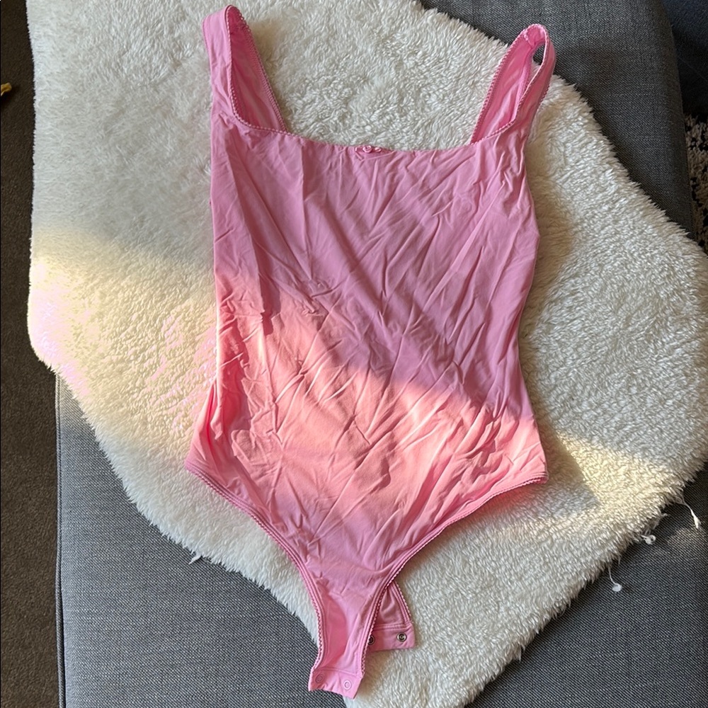 Skim’s pink bodysuit
